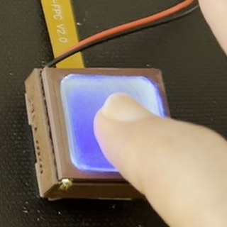 A fingertip on the GlowTact pad